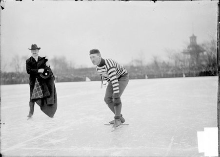 Speed skater, unidentified man, in starting position, Humboldt Park - Chicago Daily News, Inc.