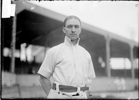 Baseball player, Davy Jones, Chicago Cubs, standing near grandstand, West Side Grounds - Chicago Daily News, Inc.