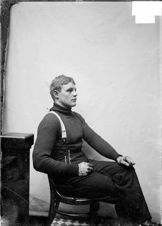 Pugilist, Fred Cooley, sitting in profile - Chicago Daily News, Inc.