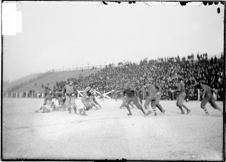 Football game, Hyde Park High School-North Division High School, blocking with players down, Marshall Field - Chicago Daily News, Inc.