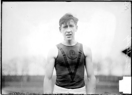 Athlete, George Shipley, standing outdoors, facing the camera - Chicago Daily News, Inc.