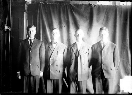 Swimmers, water relay team, Yale, Rogers, Meigs, Hill, and Damon, standing in front of backdrop - Chicago Daily News, Inc.