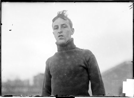 Athlete, Miller, head slightly tilted, standing at Marshall Field - Chicago Daily News, Inc.