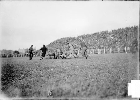 Football game, Northwestern University -University of Chicago, Marshall Field, tackle near center field - Chicago Daily News, Inc.