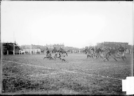 Football game, University of Chicago-Purdue University, running play, player falling, Marshall Field - Chicago Daily News, Inc.