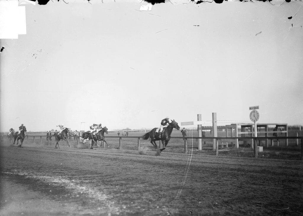 Horse racing, Worth Race Track, six horses, with jockeys mounted, racing on track - Chicago Daily News, Inc.