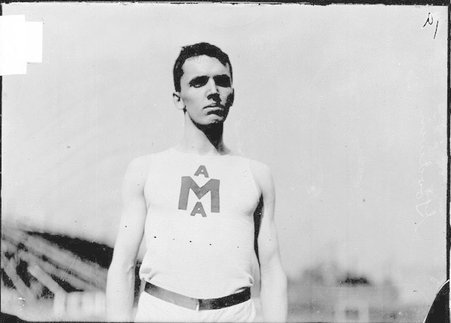 Athlete, Goodwin, University of Michigan, standing at Marshall Field - Chicago Daily News, Inc.