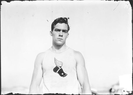 Athlete, Charles Chadwick, New York University, standing on athletic field and facing camera - Chicago Daily News, Inc.