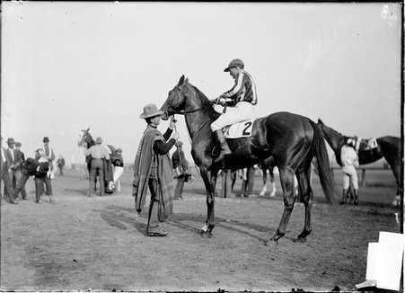 Horse, Frontenac, jockey mounted, handler holding bridle, standing in paddock area, Worth Race Track - Chicago Daily News, Inc.