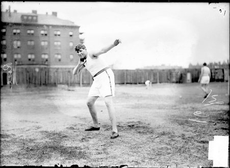 Athlete, Ralph Rose, beginning a shot put, step back stand throw at Marshall Field - Chicago Daily News, Inc.