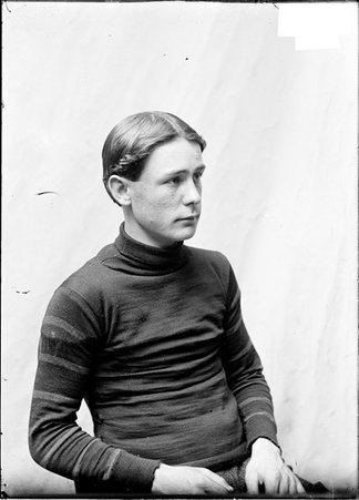 Athlete, P. G. Gunner, sitting, facing his left - Chicago Daily News, Inc.