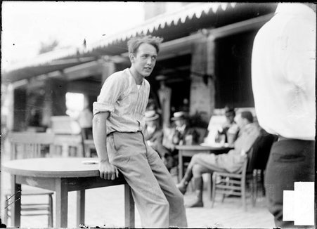 Golfer, Aldon B. Swift, sitting on a table in the clubhouse patio area, Onwentsia Country Club - Chicago Daily News, Inc.