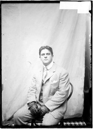 Athlete, W. W. Coe, sitting, facing the camera - Chicago Daily News, Inc.