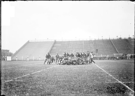 Football game, University of Chicago-Purdue University, players tackling at Marshall Field - Chicago Daily News, Inc.