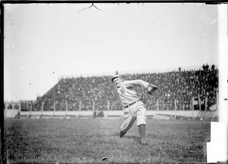 Baseball player, Barney Wolfe, pitcher, Washington Senators, throwing a ball from the outfield, South Side Park - Chicago Daily News, Inc.