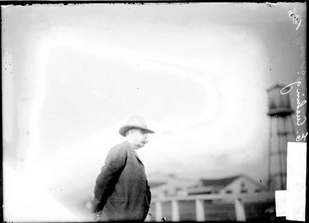 Horseman, J. E. Cushing, standing on the grounds of Worth Race Track - Chicago Daily News, Inc.