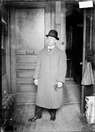 Pugilist, Sig Hart, looking to his right, standing in a room - Chicago Daily News, Inc.
