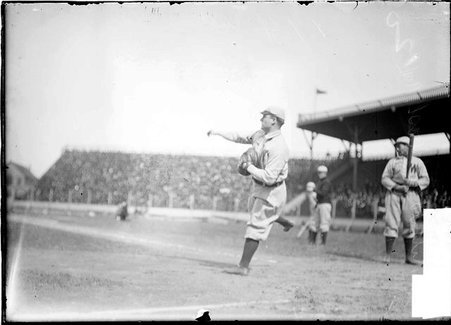 Baseball player, Malachi Kittridge, Washington Senators, throwing ball from home plate, South Side Park - Chicago Daily News, Inc.