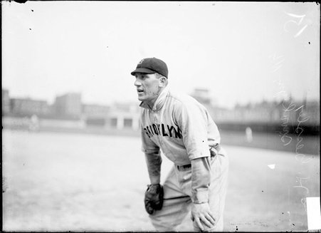 Baseball player, H. Doc Gessler, Brooklyn Superbas, standing on the field, West Side Grounds - Chicago Daily News, Inc.