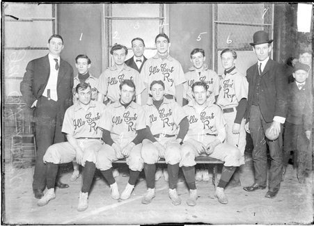 Indoor ball team, Illinois Central, gathered in a gymnasium - Chicago Daily News, Inc.