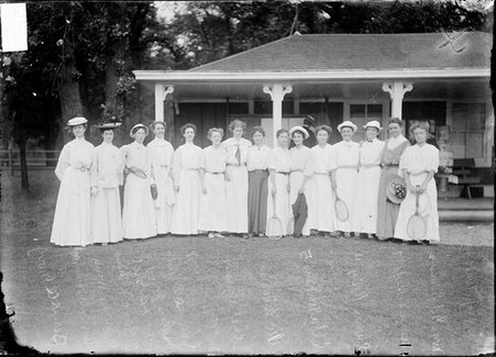 Tennis players, 15 women standing in front of a clubhouse at a tennis club - Chicago Daily News, Inc.