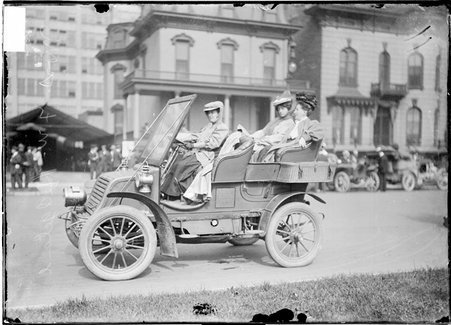 Motorist, Mrs. F. W. Hedgeland, driving a car with two women in the backseat - Chicago Daily News, Inc.