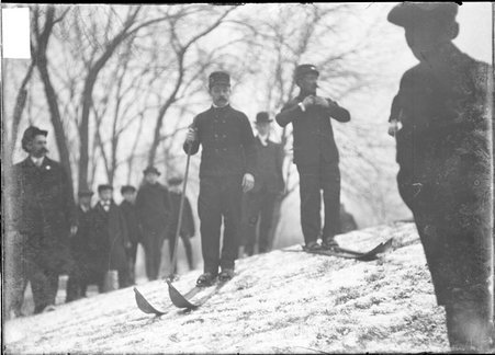 Skiing, two cross-country skiers on skis standing on the side of a hill, Humboldt Park - Chicago Daily News, Inc.