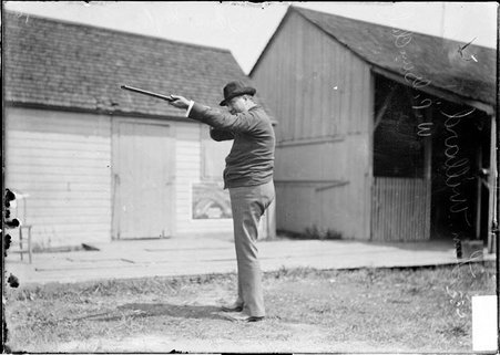Marksman, Lem Willard, pointing rifle - Chicago Daily News, Inc.