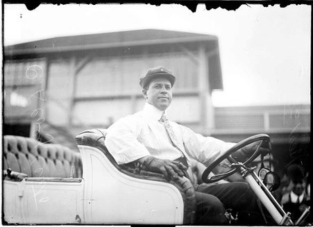 Driver, C. A. Coey, sitting in an automobile - Chicago Daily News, Inc.