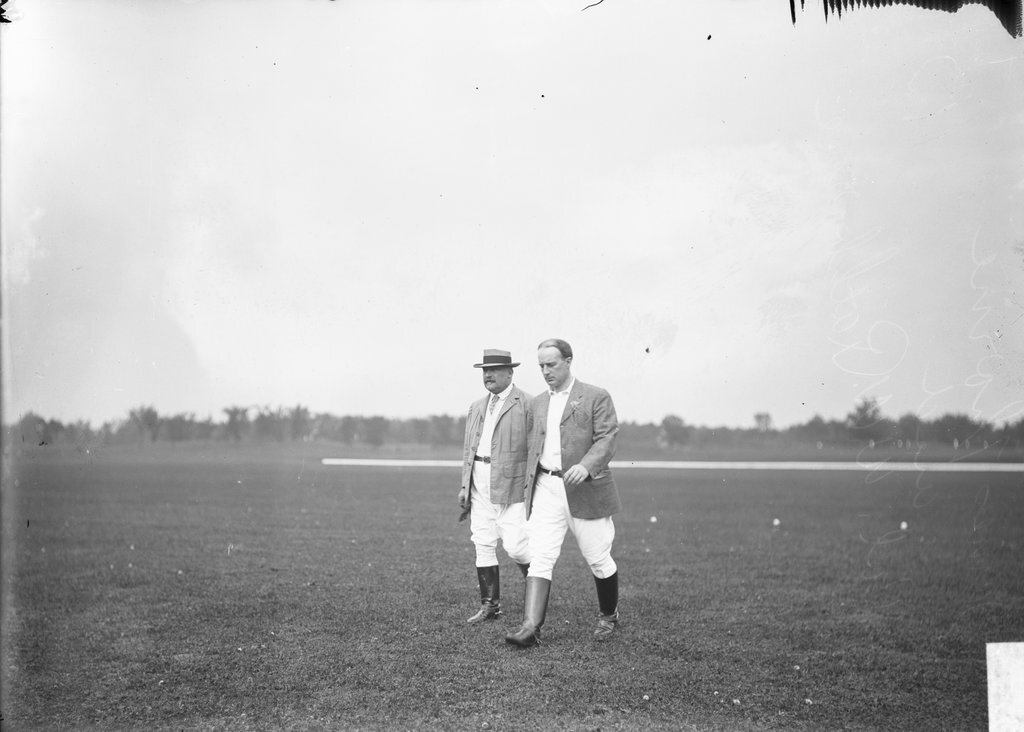 Polo players, James Thorne and Col. W. W. Rathborne, walking on polo field - Chicago Daily News, Inc.