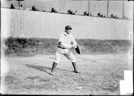 Baseball player, Jack O'Neil, Chicago National League, standing in outfield - Chicago Daily News, Inc.