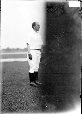 Polo player, James Thorne, standing on field - Chicago Daily News, Inc.