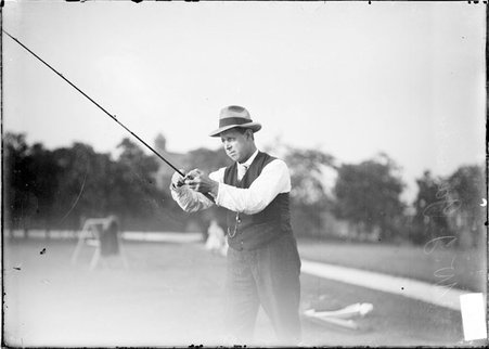 Fly casting, W. J. Jameson, retracting line - Chicago Daily News, Inc.