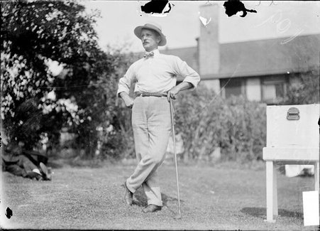 Golfer, L. Boyd, leaning on golf club - Chicago Daily News, Inc.