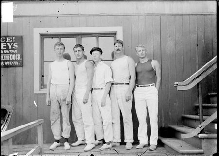 St Clair, yacht, crew, five men standing on dock - Chicago Daily News, Inc.