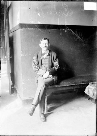 Billiards, Jake Schaefer, Sr., sitting on a bench indoors - Chicago Daily News, Inc.