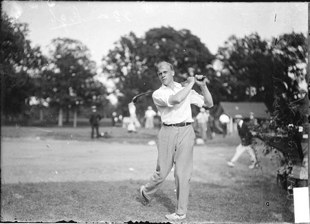 Golfer B. D. Smith, posing with a club over his shoulder on the grounds of an unidentified golf course - Chicago Daily News, Inc.