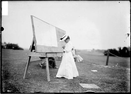 Golfer Ruth Steele, standing in front of postings board near the course at Homewood Country Club in Flossmoor, Illinois - Chicago Daily News, Inc.
