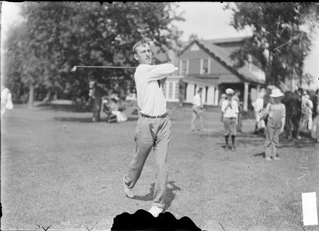 Golfer, Harold Webber, swinging golf club behind his back - Chicago Daily News, Inc.