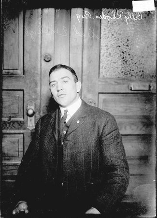 Pugilist, Billy Rhodes, facing camera, sitting in a room - Chicago Daily News, Inc.