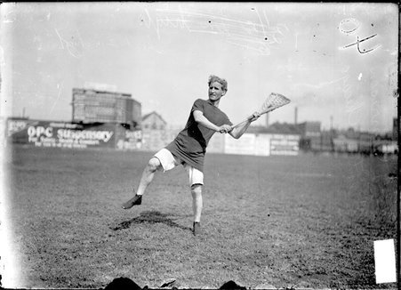 Lacrosse player C. A. Morrison, throwing the ball during a match on the field at South Side Park - Chicago Daily News, Inc.