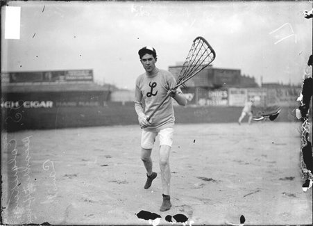 Lacrosse player J. S. Colquhoun, of the London, Canada team, holding his stick in front of him on the field at South Side Park - Chicago Daily News, Inc.