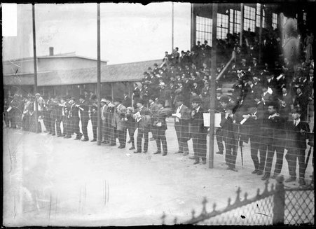 Automobile racing, spectators gathered along the track fence, concourse and grandstand, Harlem Race Track - Chicago Daily News, Inc.