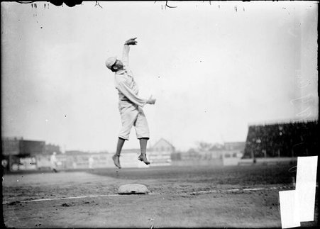 New York Highlanders third baseman Joe Yeager, jumping in the air to catch the ball at third base at South Side Park - Chicago Daily News, Inc.