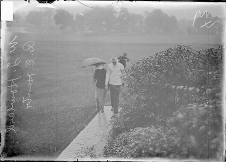 Golfers, Hunter and Howland walking on a boardwalk, Westward Ho Golf Club - Chicago Daily News, Inc.