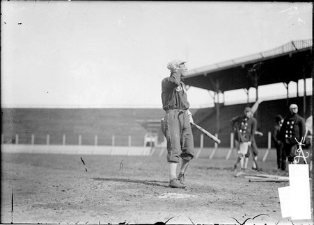 Baseball player, Danny Green, Chicago White Sox, standing near home plate holding a bat, looking toward the stands, South Side Park - Chicago Daily News, Inc.
