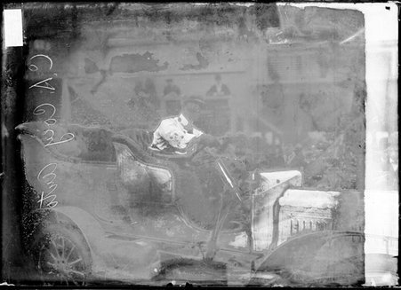 Driver, C. A. Coey sitting behind the wheel of an automobile - Chicago Daily News, Inc.