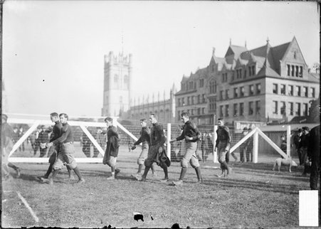 University of Iowa football team walking on the grass at Marshall Field - Chicago Daily News, Inc.