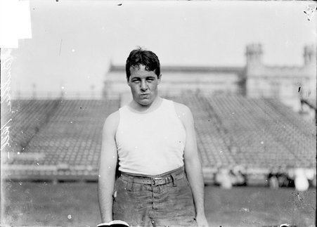 Football player, Bubbles Hill, standing on the field at Marshall Field - Chicago Daily News, Inc.