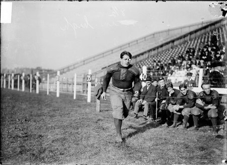 Football player, Bubbles Hill, running on the field close to the sideline at Marshall Field - Chicago Daily News, Inc.